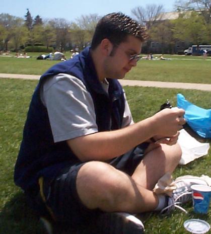 Chris sitting on the grass